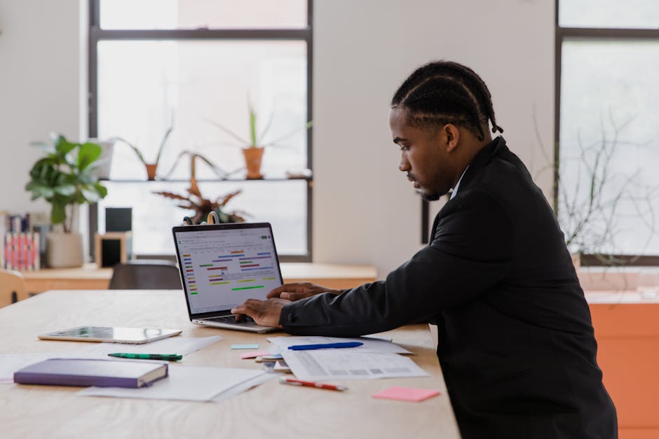 How Project Managers Can Solve Common PDF Problems Online - project manager working with PDF documents on laptop