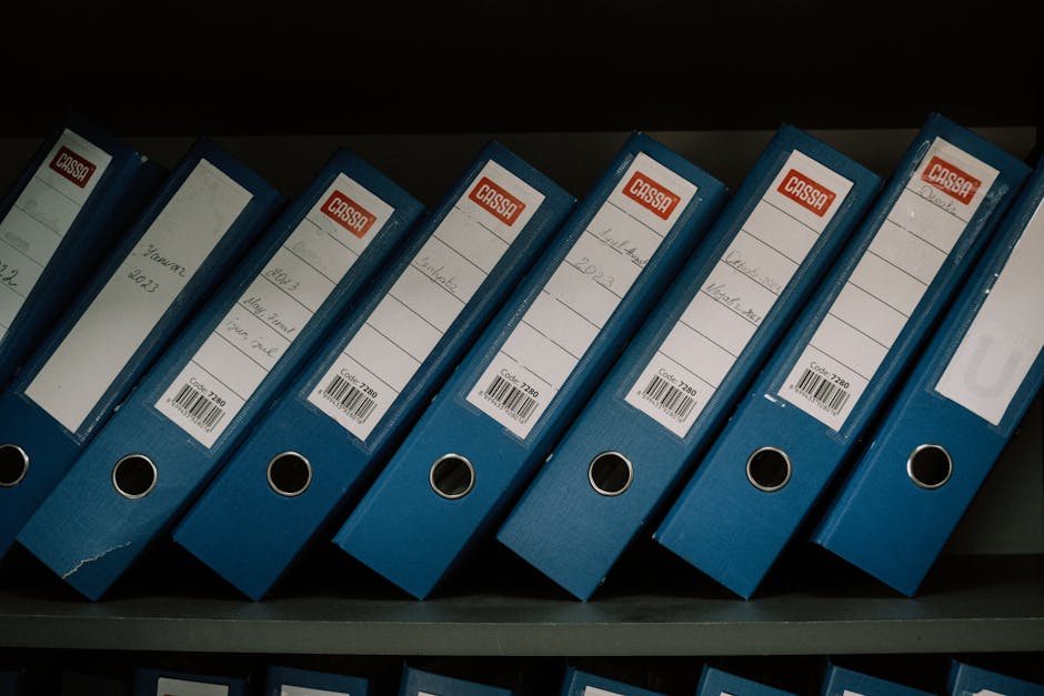Paperless Record Keeping: A Practical Guide for Finance Teams - organized digital filing cabinet with barcode labels
