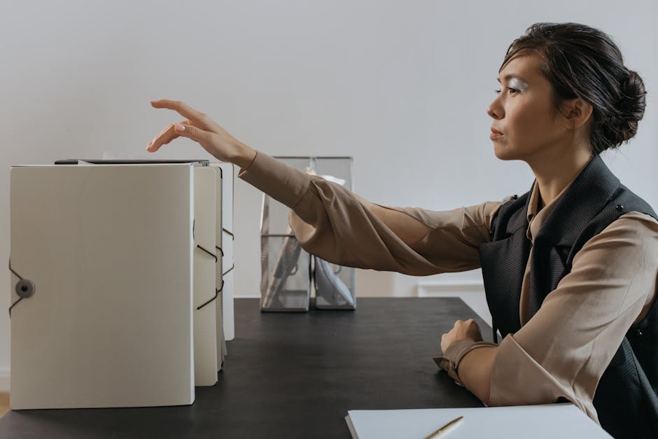 A HR Manager's Guide to Managing PDFs for Client Onboarding - HR manager organizing documents on desk